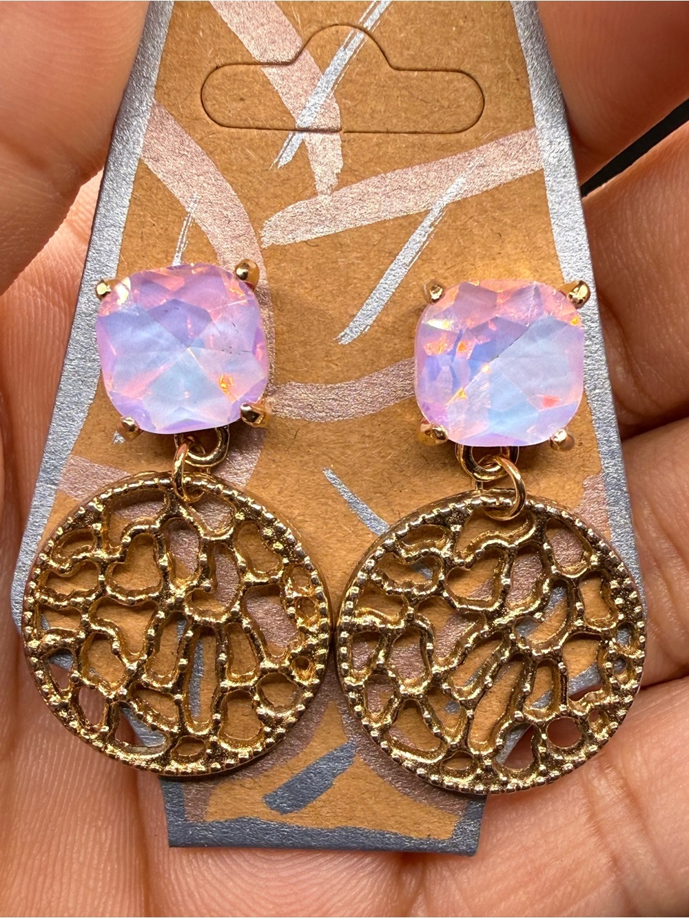 Cushion cut lavender iridescent stud crystal with a gold abstract disc earrings.
